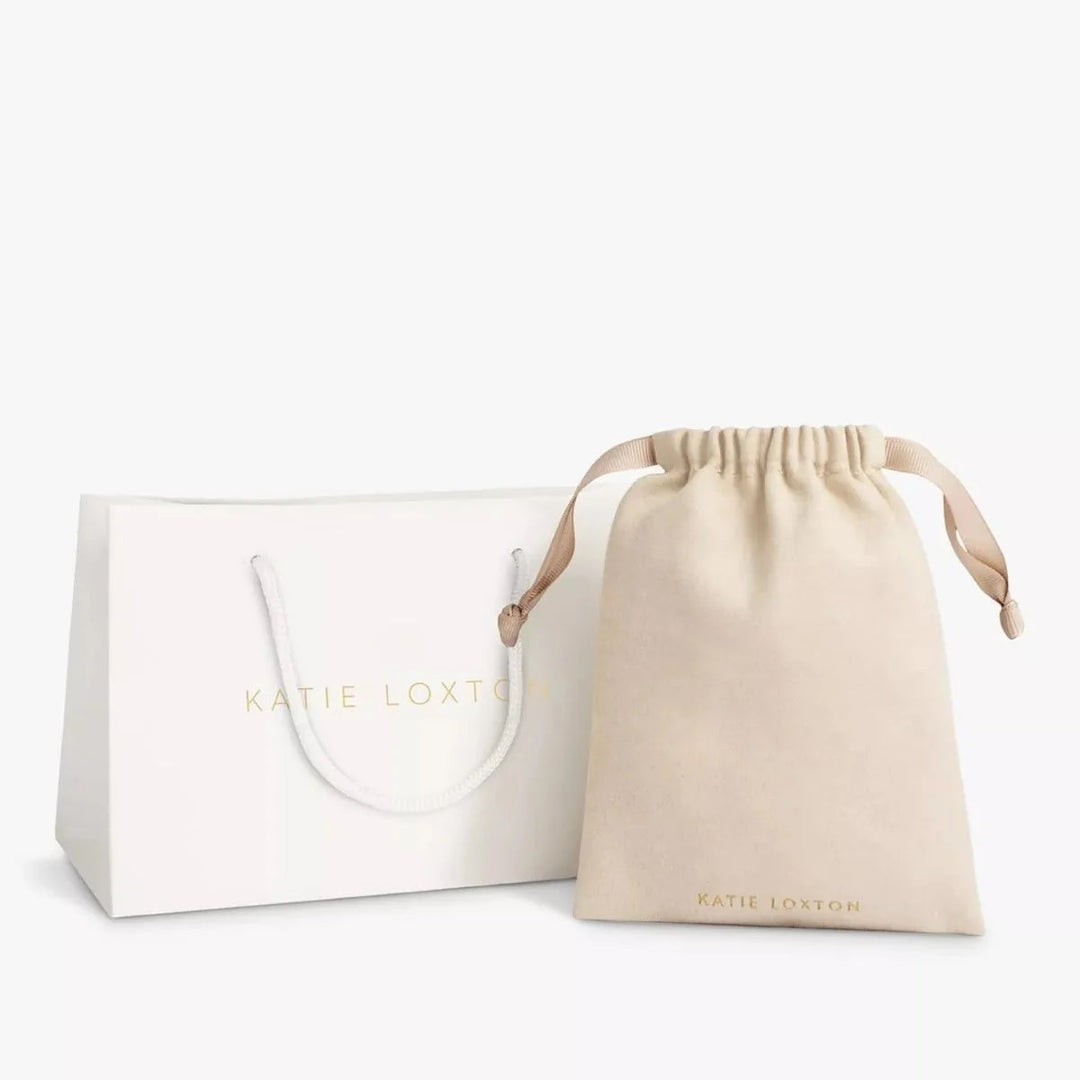 Niche Jewellery Katie Loxton branded white gift bag and beige velvet drawstring pouch for jewellery packaging