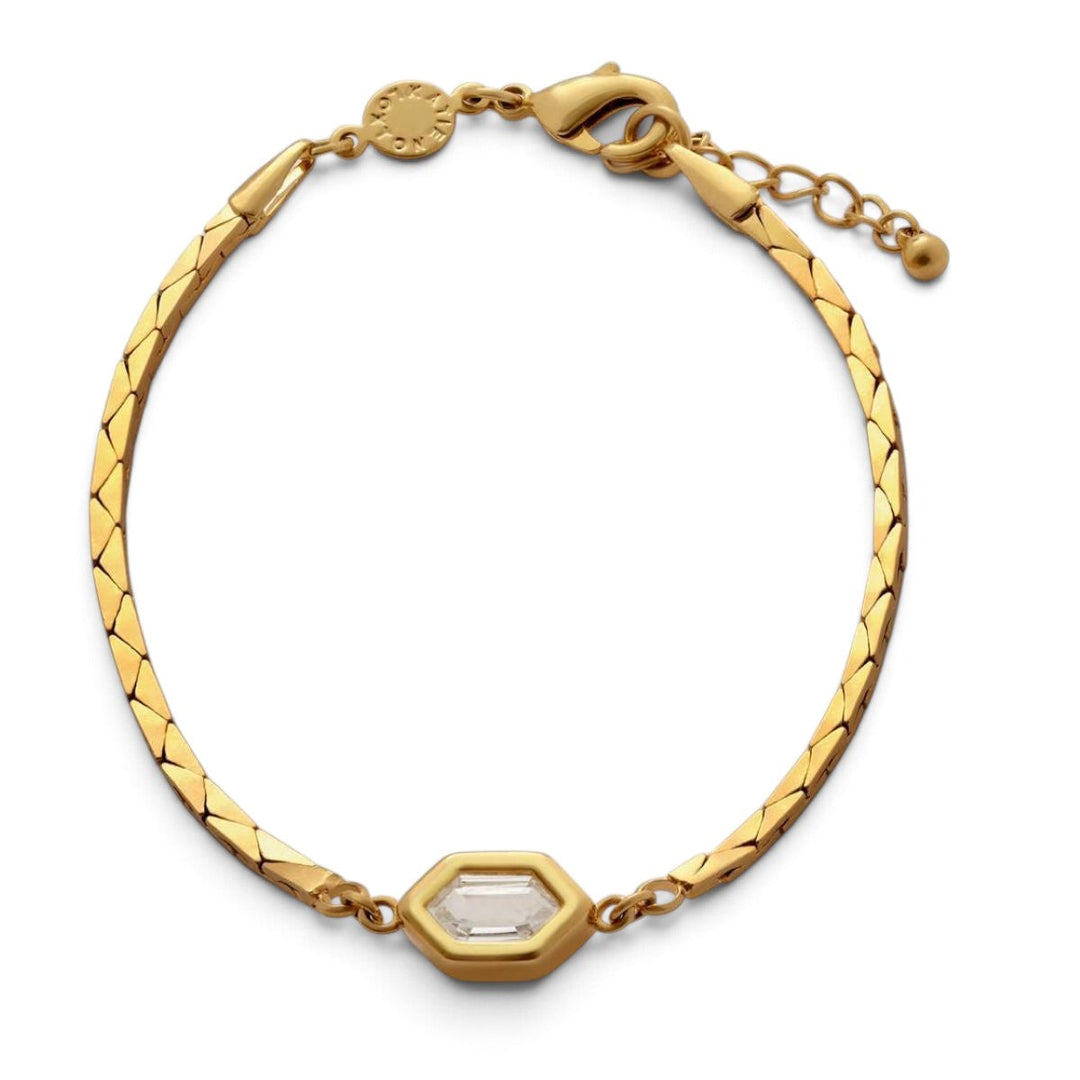 Niche Jewellery Katie Loxton gold-tone waterproof bracelet with diamond-check motif and central crystal charm.