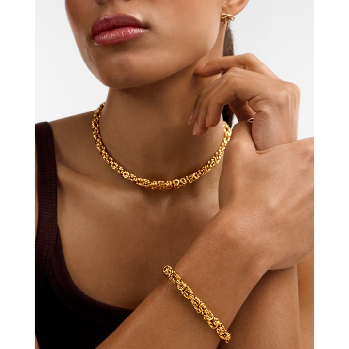 Niche Jewellery Katie Loxton Heritage waterproof gold Byzantine chain bracelet worn on a model's wrist