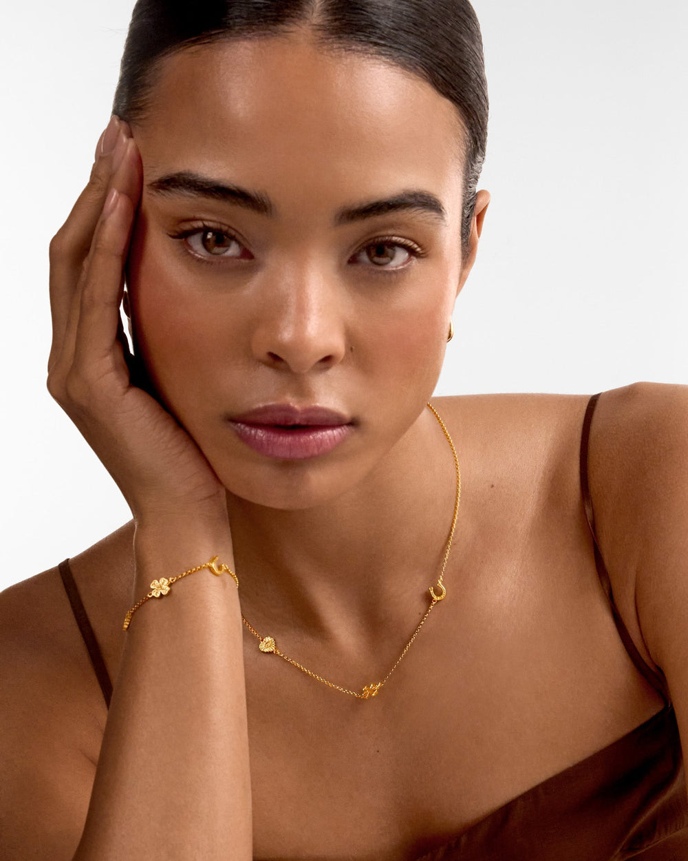 Niche Jewellery Katie Loxton gold-tone waterproof necklace featuring delicate good-luck charms on a fine chain