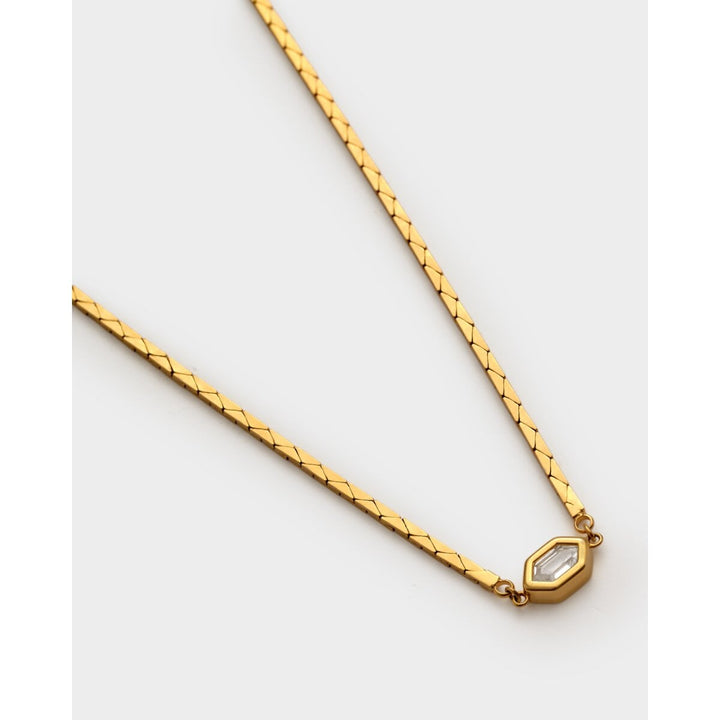 Niche Jewellery Katie Loxton gold-tone waterproof necklace with a diamond-check pendant on a fine chain.