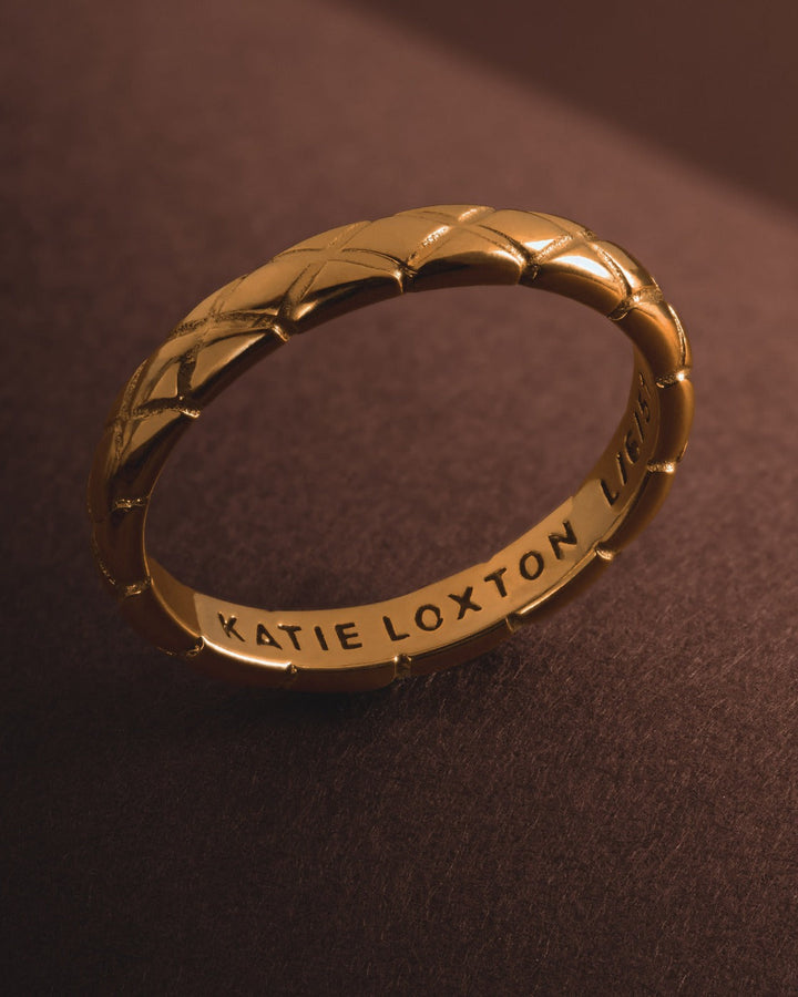 Niche Jewellery Katie Loxton gold-tone waterproof ring featuring a diamond-check pattern on a slim band.