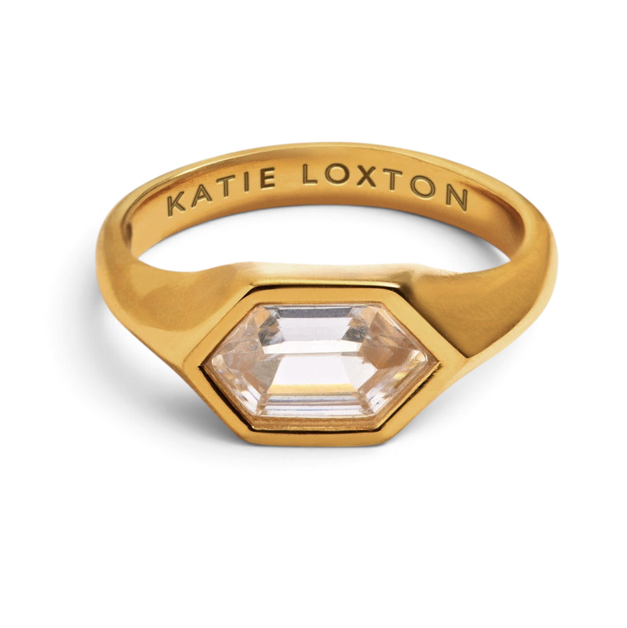 Niche Jewellery Katie Loxton gold waterproof statement ring with a hexagonal clear stone and engraved inner band.