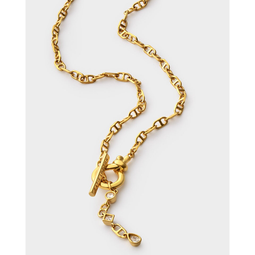Niche Jewellery Katie Loxton gold-tone waterproof necklace with a toggle clasp and sparkling crystal pendants.