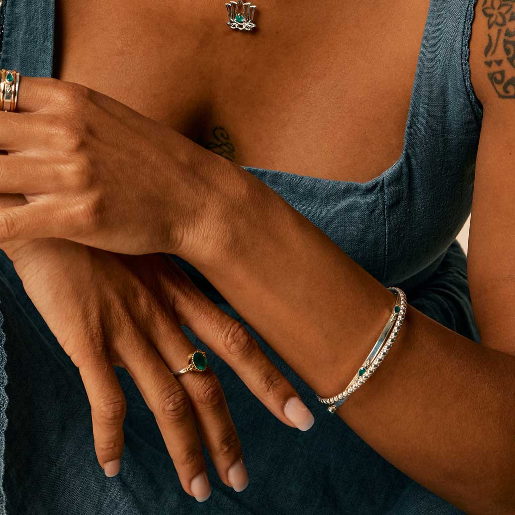 Niche Jewellery Charlotte's Web Maharani sterling silver stacking bangle with signature bubble detailing on a wrist