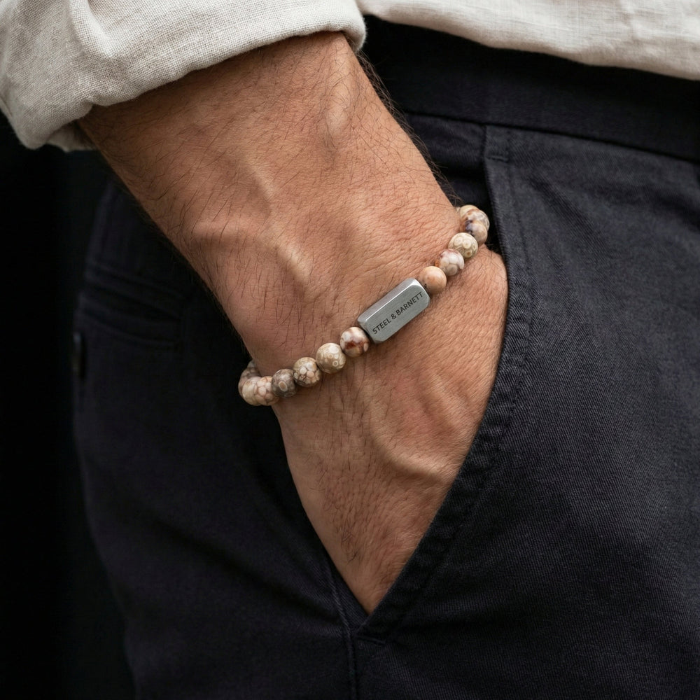Niche Jewellery Steel & Barnett 6mm round maifanite bead bracelet with stainless steel accent on a man's wrist