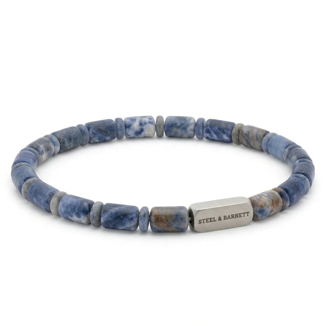 Niche Jewellery Steel & Barnett matte sodalite barrel bead bracelet with a brushed stainless steel logo accent.