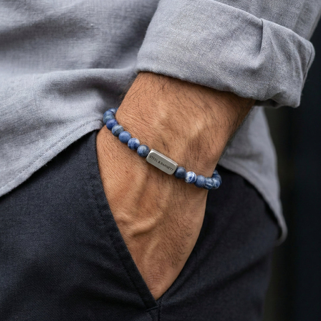Niche Jewellery Steel & Barnett matte sodalite bead bracelet with stainless steel accent on a man's wrist.