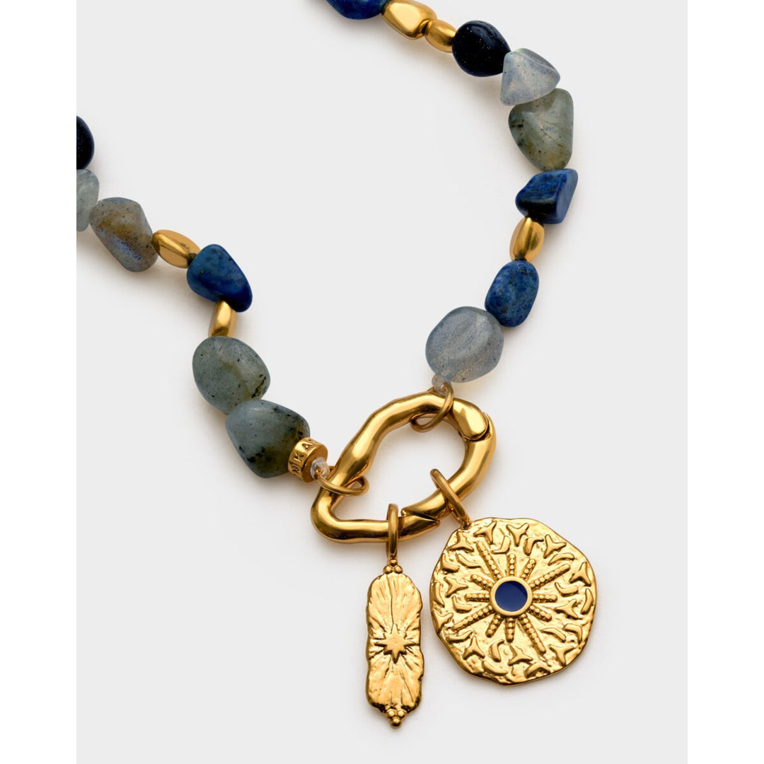 Niche Jewellery Katie Loxton Midnight Solesi waterproof gold bracelet with navy semi-precious stones and sun charms.