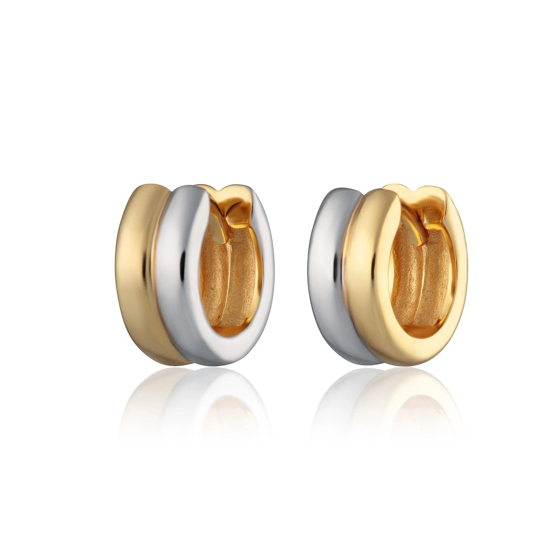 Niche Jewellery Scream Pretty mixed metal huggie earrings featuring a two-tone gold and silver finish.