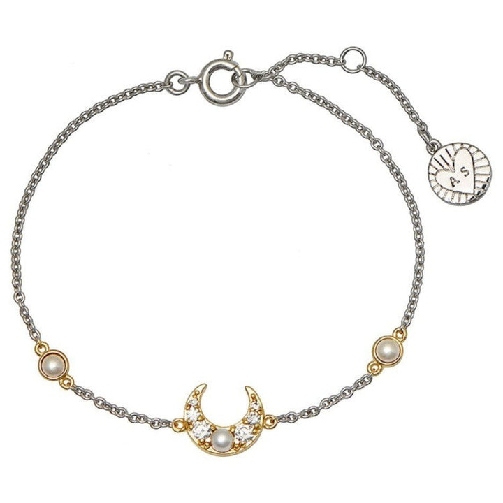 Niche Jewellery silver and gold chain bracelet with a crescent moon charm adorned with pearls and cubic zirconia.