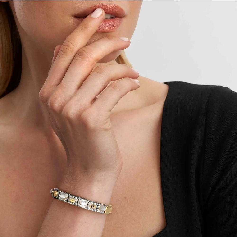 Niche Jewellery Nomination stainless steel charm bracelet with 18k gold and red enamel heart family charm.