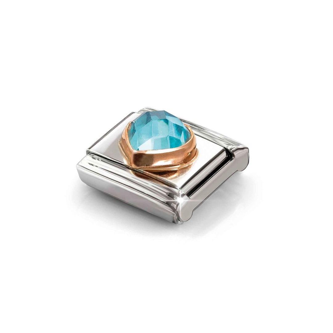 Niche Jewellery Nomination stainless steel charm with a rose gold setting and a faceted light blue heart zirconia