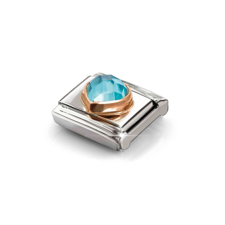 Niche Jewellery Nomination stainless steel charm with a rose gold setting and a faceted light blue heart zirconia