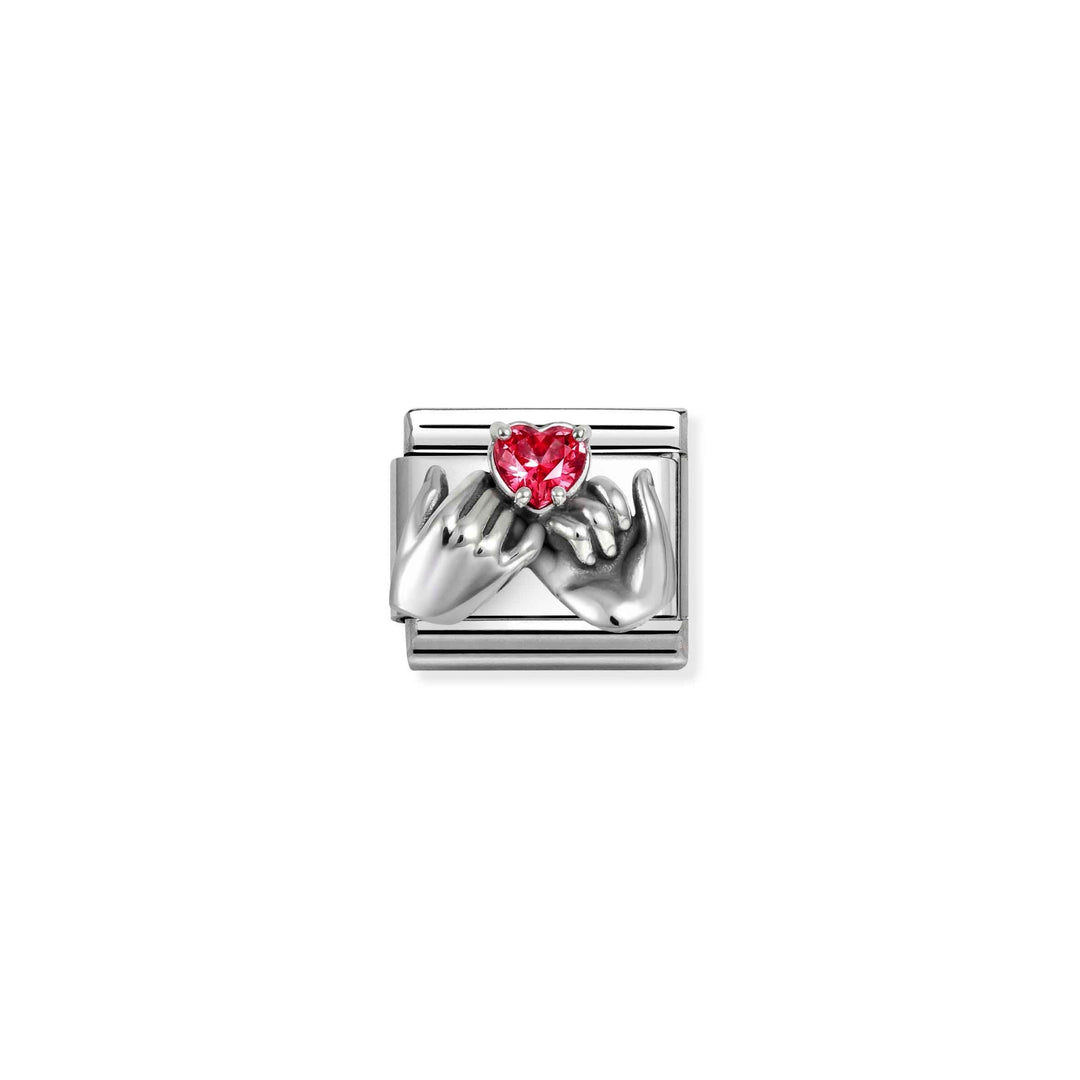Niche Jewellery Nomination charm featuring oxidised silver hands forming a heart with a red zirconia stone