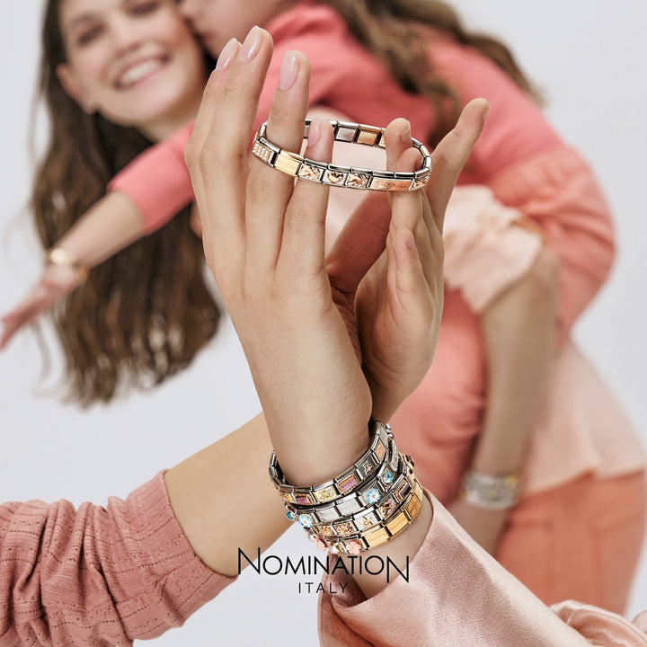 Niche Jewellery Nomination charm bracelet featuring a rose gold and enamel watering can with flowers design
