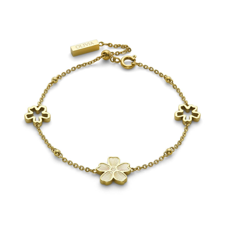 Niche Jewellery Olivia Burton gold-plated bracelet featuring delicate forget-me-not flower charms on a fine chain.