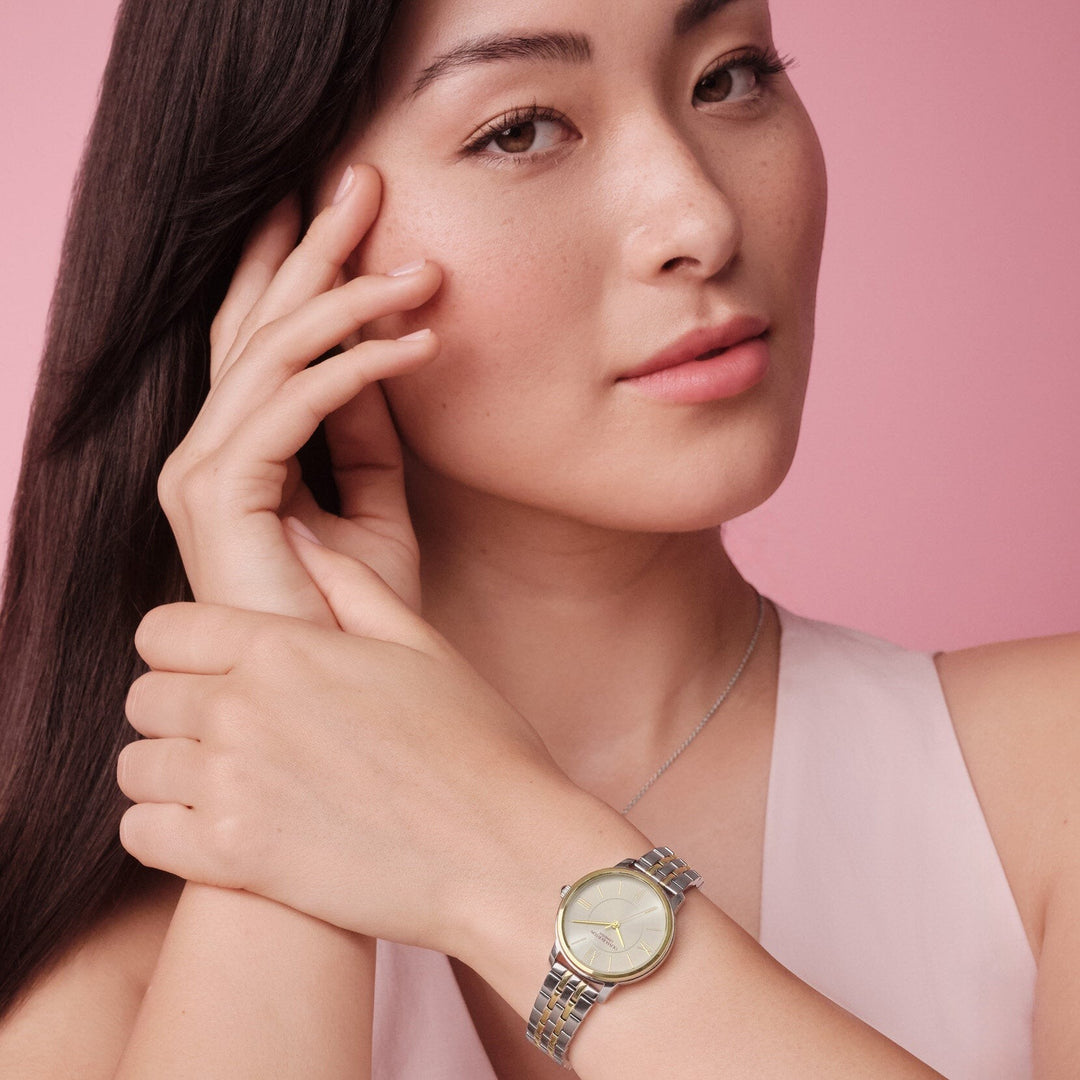 Niche Jewellery Olivia Burton Westbourne watch with a white dial and two-tone gold and silver bracelet on a model