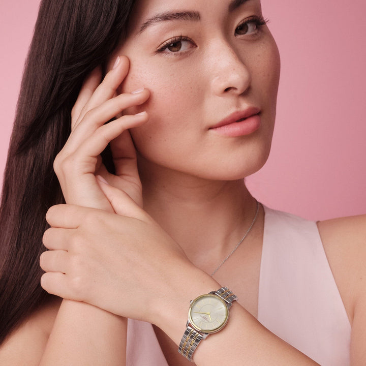 Niche Jewellery Olivia Burton Westbourne watch with a white dial and two-tone gold and silver bracelet on a model