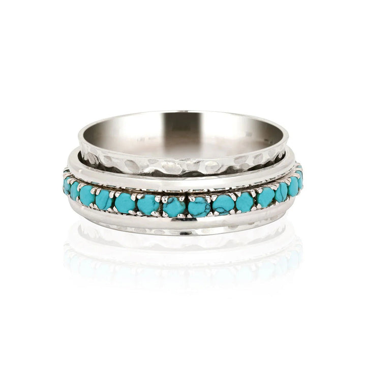 Niche Jewellery Charlotte's Web Parvati spinning ring in recycled sterling silver with turquoise stones.
