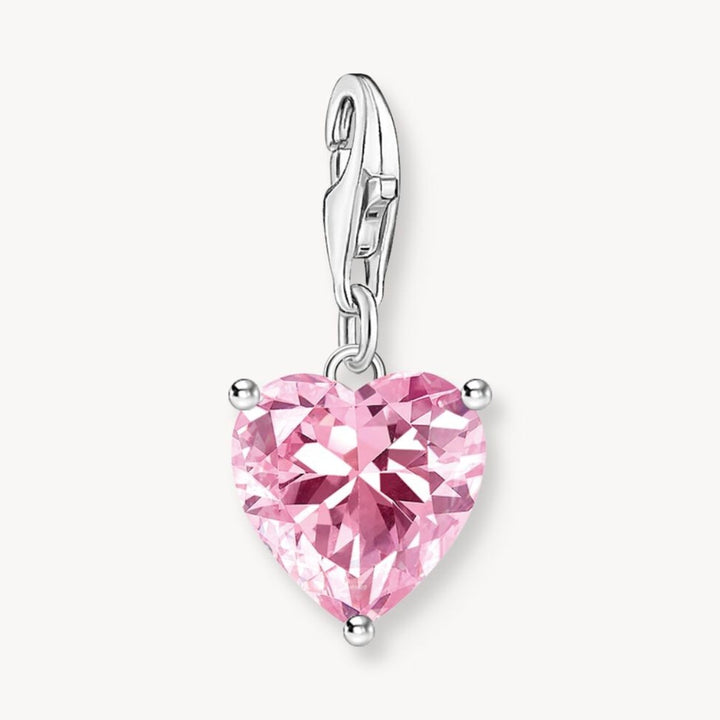 Thomas Sabo pink heart-shaped zirconia charm pendant with silver clasp. Faceted stone.