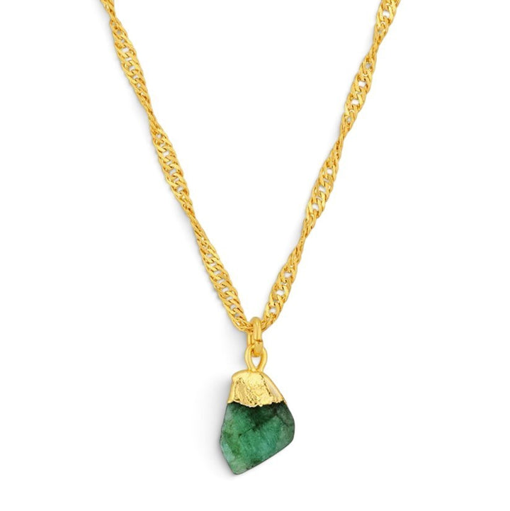 Niche Jewellery Formation Co Mohica necklace featuring a raw-cut emerald pendant on an 18k gold-plated twisted chain.
