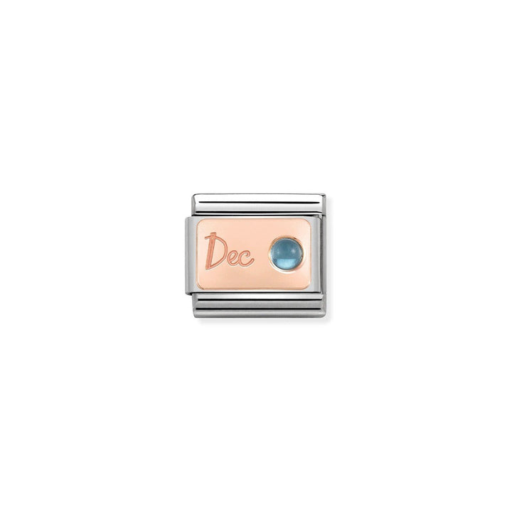 Niche Jewellery rose gold charm with 'Dec' engraving and a blue topaz gemstone, representing December birthstone.
