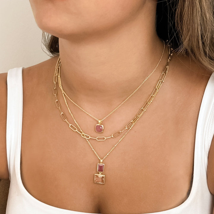 Niche Jewellery Sakura necklace with strawberry quartz and morganite pendants on an 18ct gold-plated bobble chain.