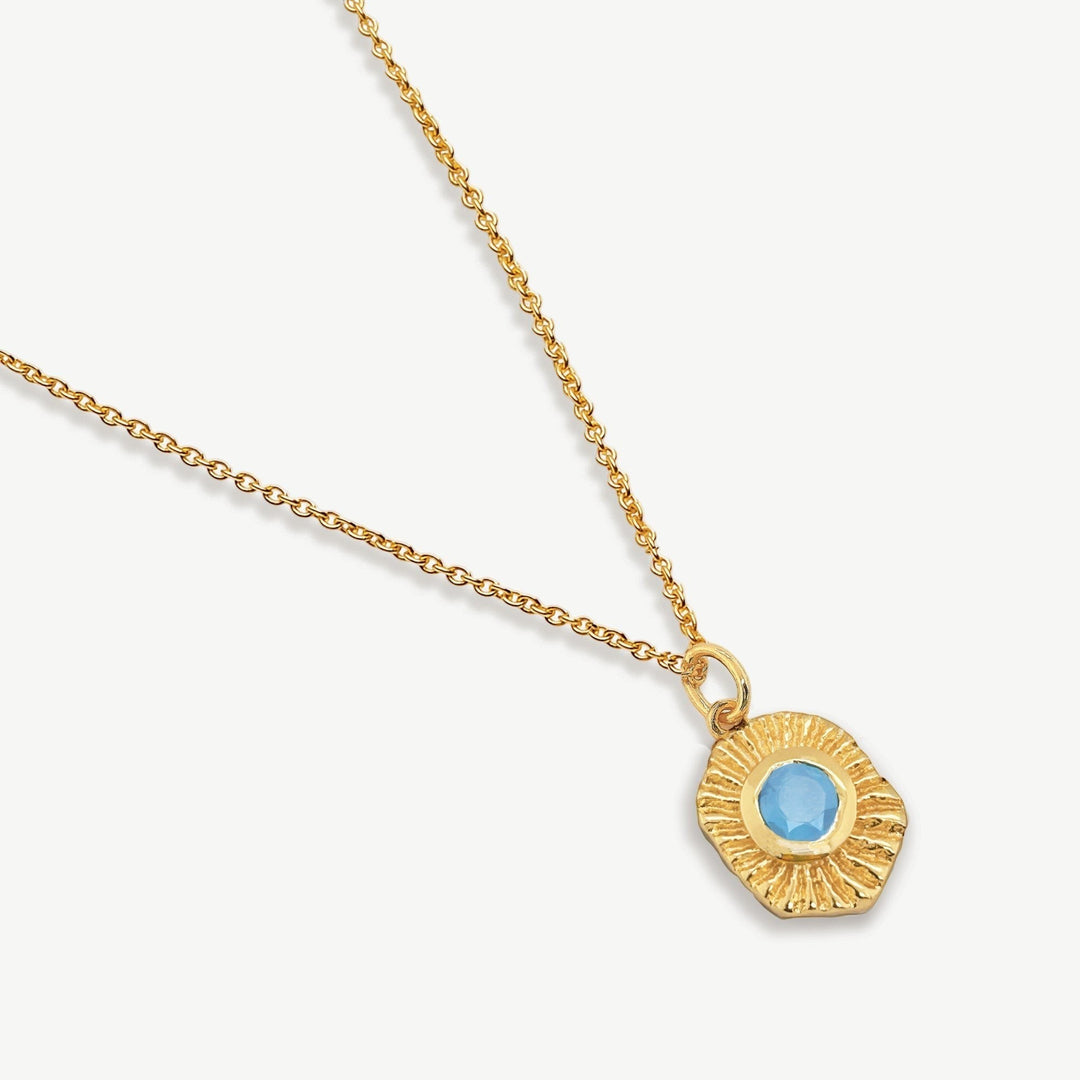 Niche Jewellery Sarah Alexander Samoa gold talisman pendant necklace with a blue chalcedony gemstone on a fine chain.