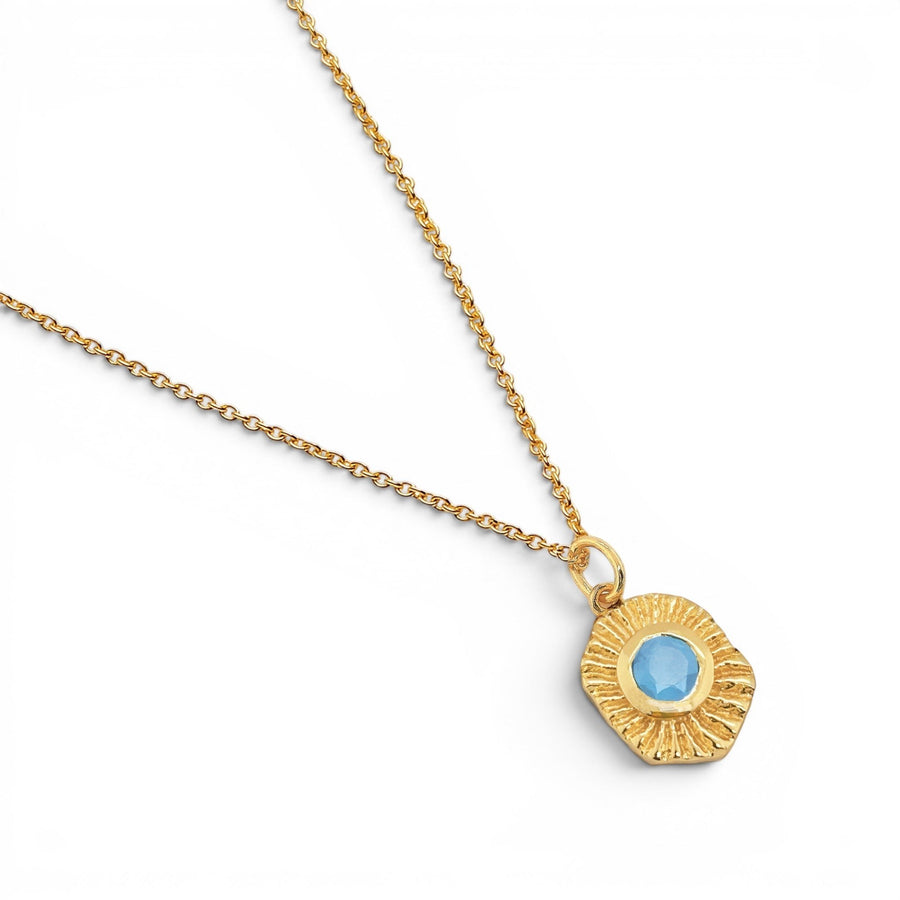 Niche Jewellery Sarah Alexander Samoa talisman pendant necklace featuring an 18ct gold plated sunburst and blue chalcedony