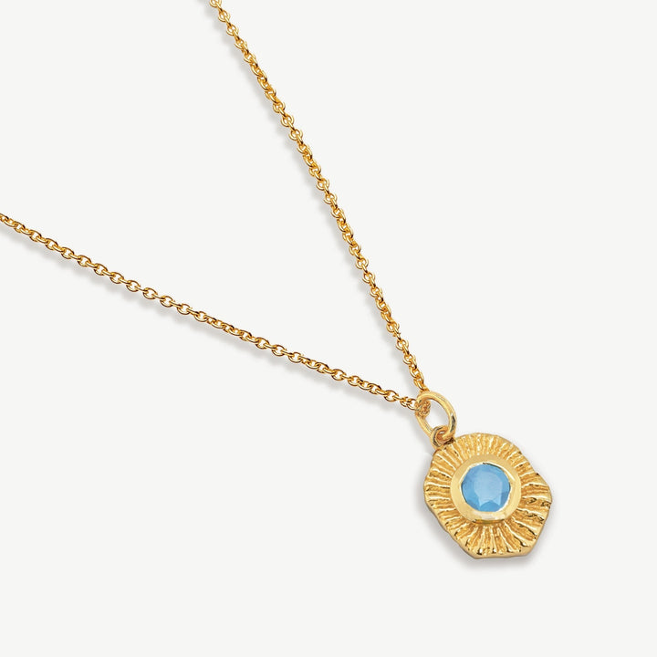 Niche Jewellery Sarah Alexander Samoa talisman pendant necklace in 18ct gold plate with a blue chalcedony gemstone.