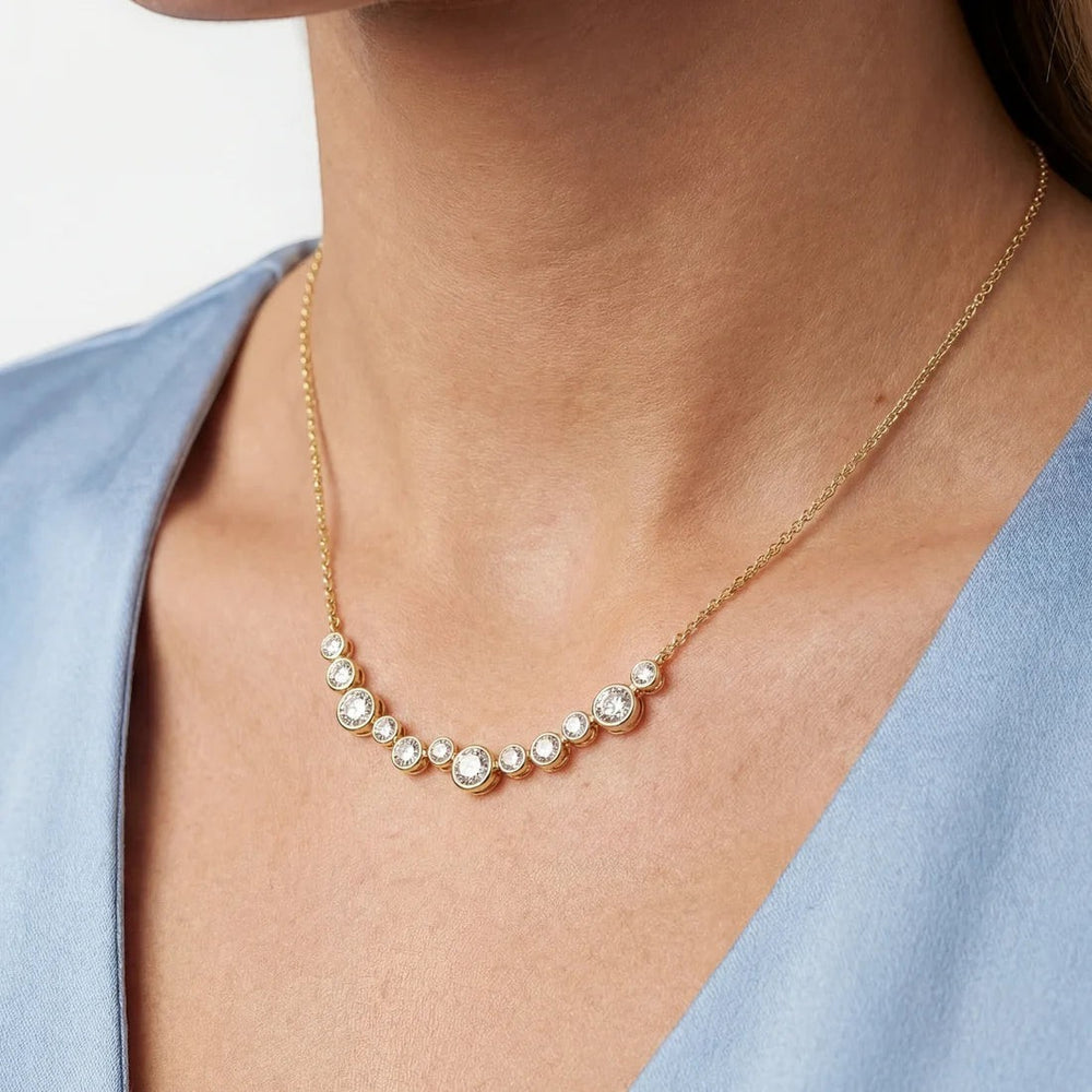 Niche Jewellery Sif Jakobs Sardinien Dodici gold-plated necklace with white zirconia stones on a model