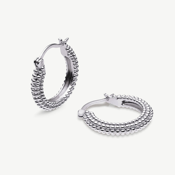 Niche Jewellery Sarah Alexander Sedona rhodium-plated silver hoop earrings with a textured bobble design.