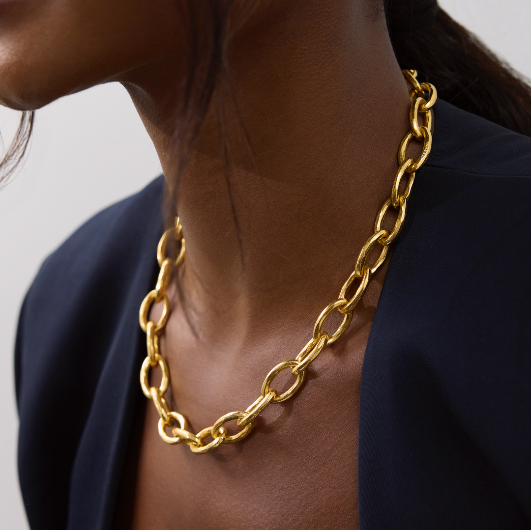 Niche Jewellery Shyla Tangier gold chunky chain necklace worn on a model with a dark blazer