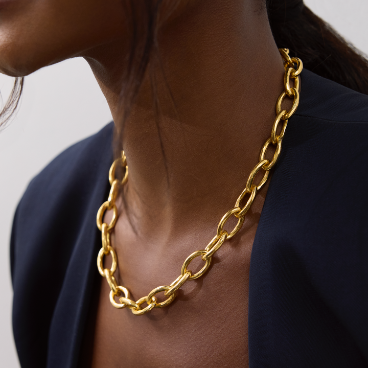 Niche Jewellery Shyla Tangier gold chunky chain necklace worn on a model with a dark blazer