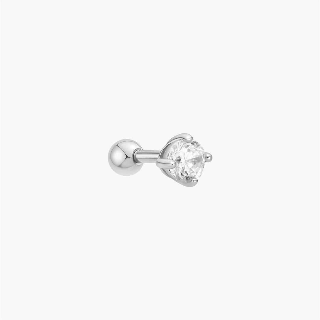 Niche Jewellery Ania Haie silver barbell earring featuring a round cubic zirconia stone in a prong setting.