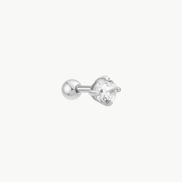 Niche Jewellery Ania Haie silver barbell earring featuring a round cubic zirconia stone in a prong setting.