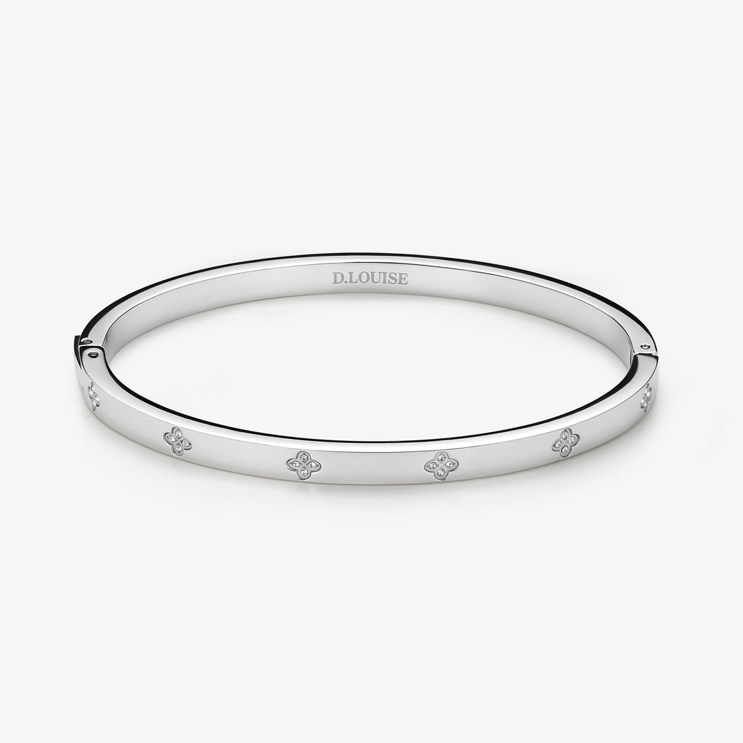 Niche Jewellery D.Louise silver stainless steel bangle with clover motifs and crystals. Waterproof and tarnish-free.