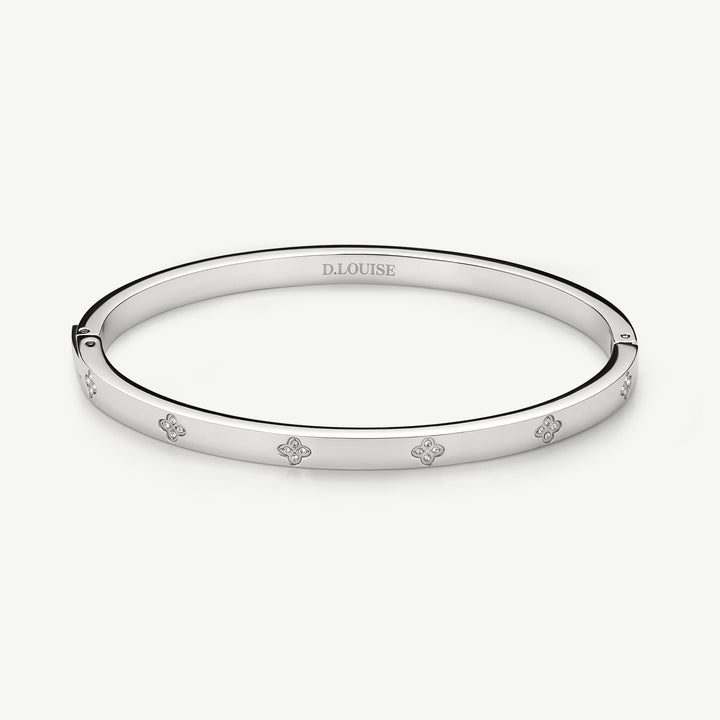 Niche Jewellery D.Louise silver stainless steel bangle with clover motifs and crystals. Waterproof and tarnish-free.