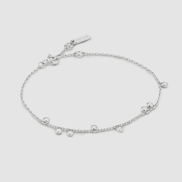 Niche Jewellery Ania Haie sterling silver chain bracelet featuring bezel-set cubic zirconia droplet stations.