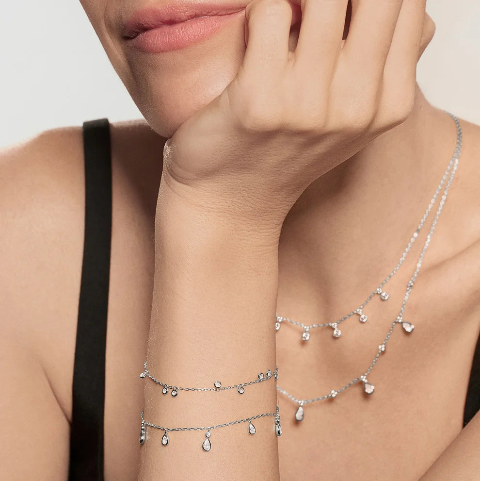 Niche Jewellery Ania Haie sterling silver bracelet with bezel-set cubic zirconia droplets worn on a model's wrist