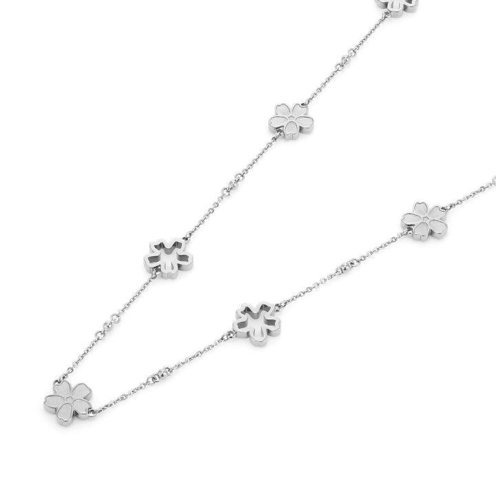 Niche Jewellery Olivia Burton silver tone necklace featuring delicate forget-me-not floral charms on a fine chain.