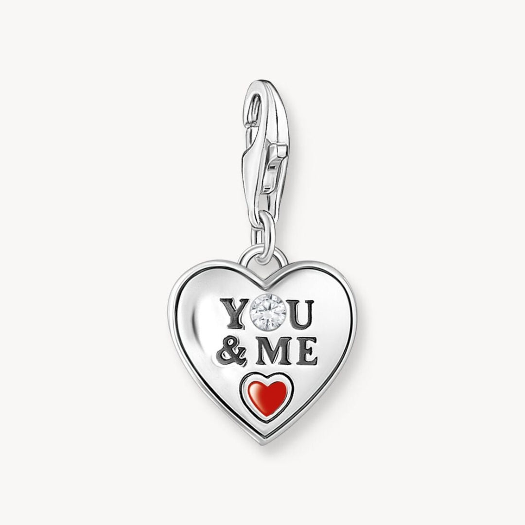 Niche Jewellery silver heart charm with 'YOU & ME' engraving, white zirconia, red enamel heart, and infinity symbol.