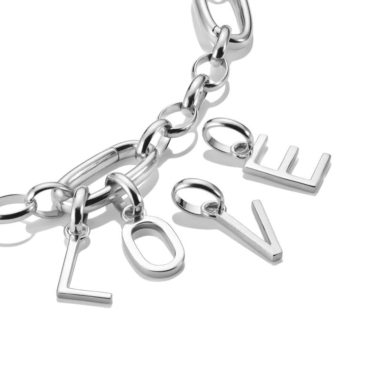 Niche Jewellery silver letter E charm crafted from 925 sterling silver, minimalist design with eyelet for bracelets and necklaces.