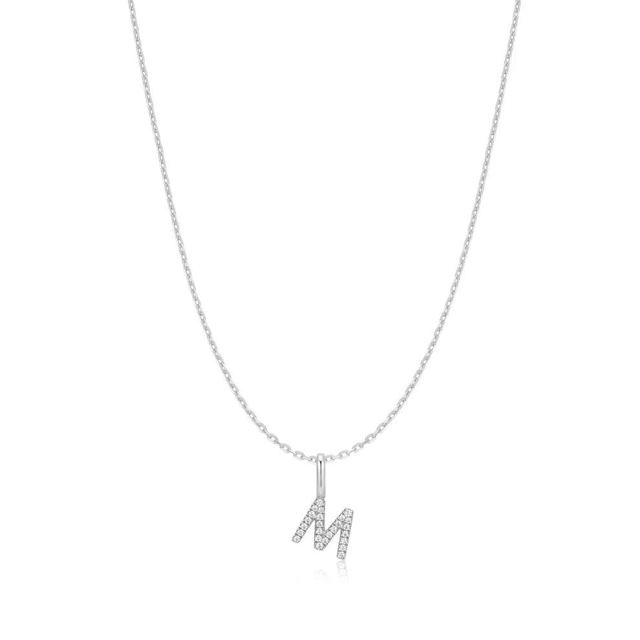 Niche Jewellery Ania Haie sterling silver necklace featuring a delicate letter M initial pendant with small crystals.