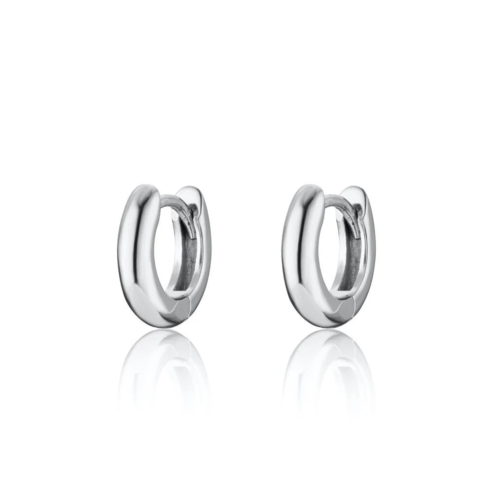 Niche Jewellery Scream Pretty sterling silver mini huggie hoop earrings for everyday wear.