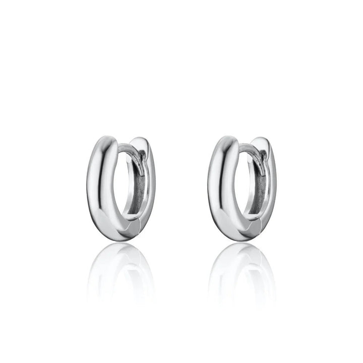 Niche Jewellery Scream Pretty sterling silver mini huggie hoop earrings for everyday wear.