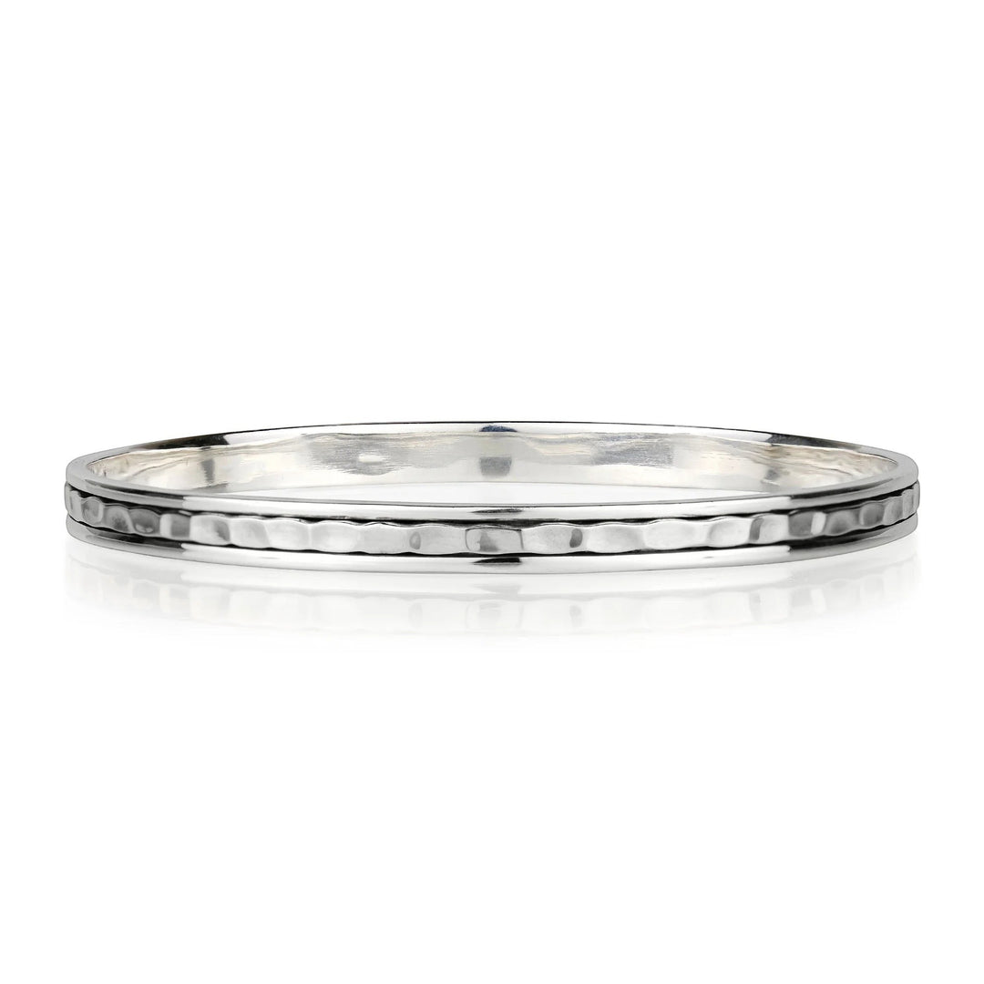Niche Jewellery Charlotte's Web sterling silver stacking bangle with a hammered texture and a spinning band.