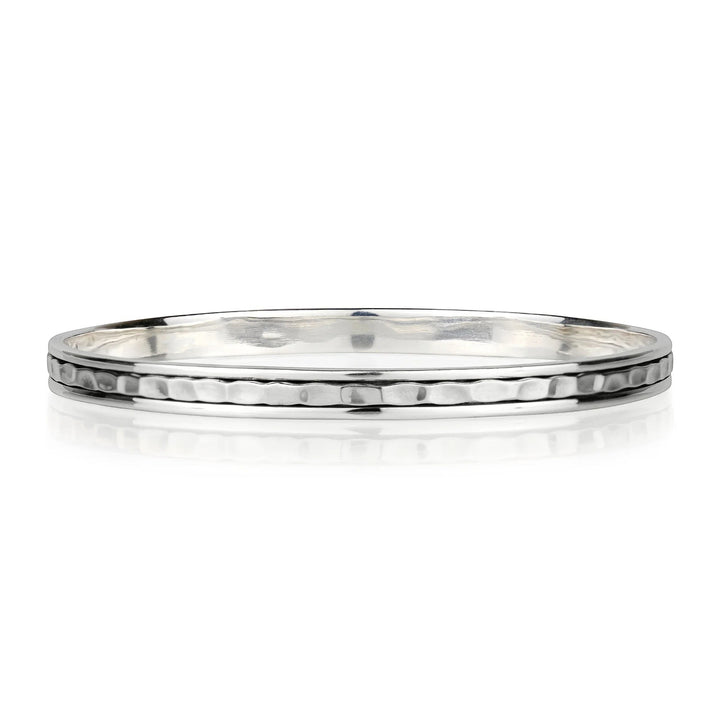 Niche Jewellery Charlotte's Web sterling silver stacking bangle with a hammered texture and a spinning band.