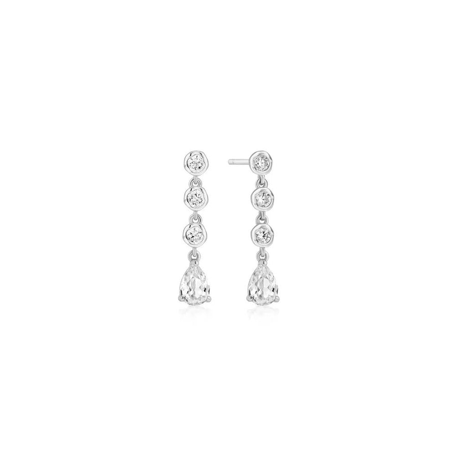 Niche Jewellery Ania Haie silver stud earrings featuring bezel-set round and teardrop stones in a molten cascade design.
